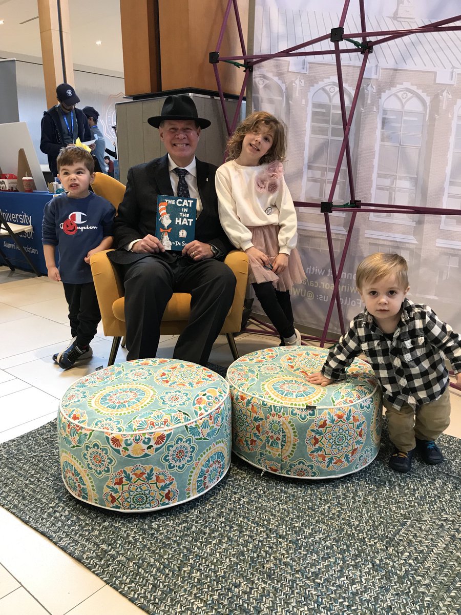 Reading The Cat in the Hat to some very attentive children as part of Hats on for Healthcare. The Dr. Seuss classic.