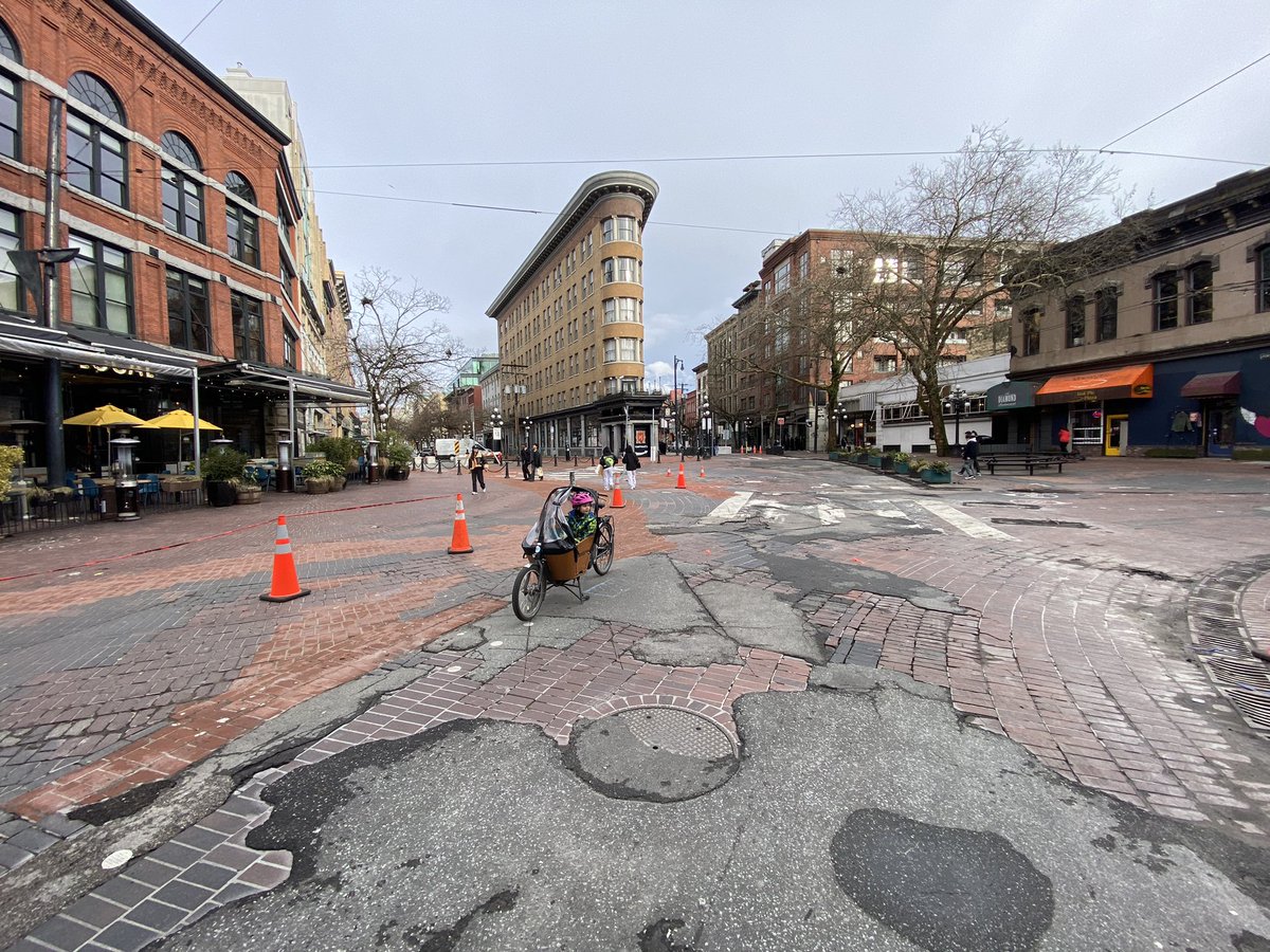 Mikezipf's tweet photo. Car free gastown.  Never stopped to look at the buildings from the middle of the road before.  Will look great once the bricks are repaired. https://t.co/VUEcxFu6oQ