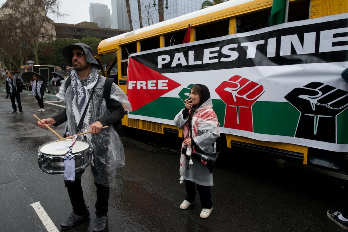 andrew_goetze's tweet photo. Hands Off Rafah protest, DTLA.
a) "Not anti-semetic" but what's that on her face?
b) There's a new martyr in town (center).
c &amp; d) Teach your children well.

1/2 https://t.co/jcRiX5ROc1