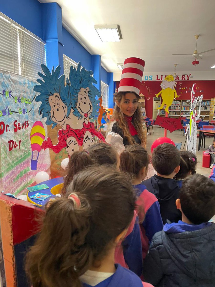LibraryDawha's tweet photo. Guess who made a surprise visit to our library? 
The Cat in the Hat himself! 
Our grade 1 learners were thrilled as they encountered the cat and settled down to listen to a captivating story. 
Here’s to the magic of #DrSeuss and the joy of learning!
@makdawhaschool @HanaJoumaa https://t.co/z9eELykc79