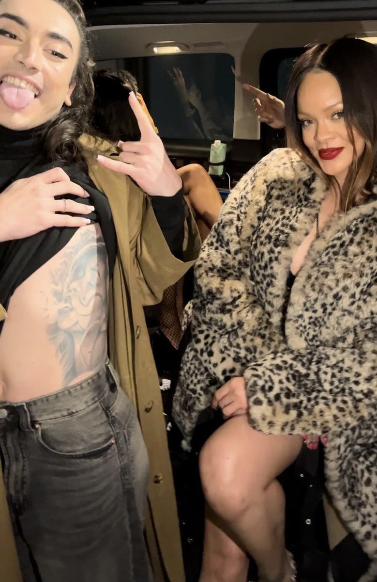 Rihanna with a fan last night.