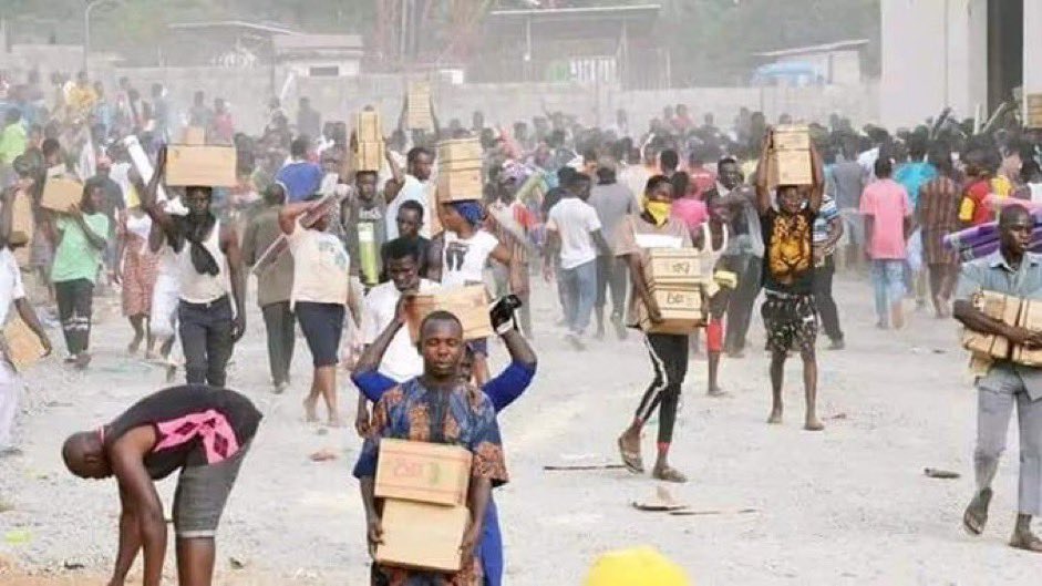 ECONOMIC HARDSHIP: Abuja Residents Invade NEMA Warehouse, Loot Foodstuffs, Cart Away Other Items.