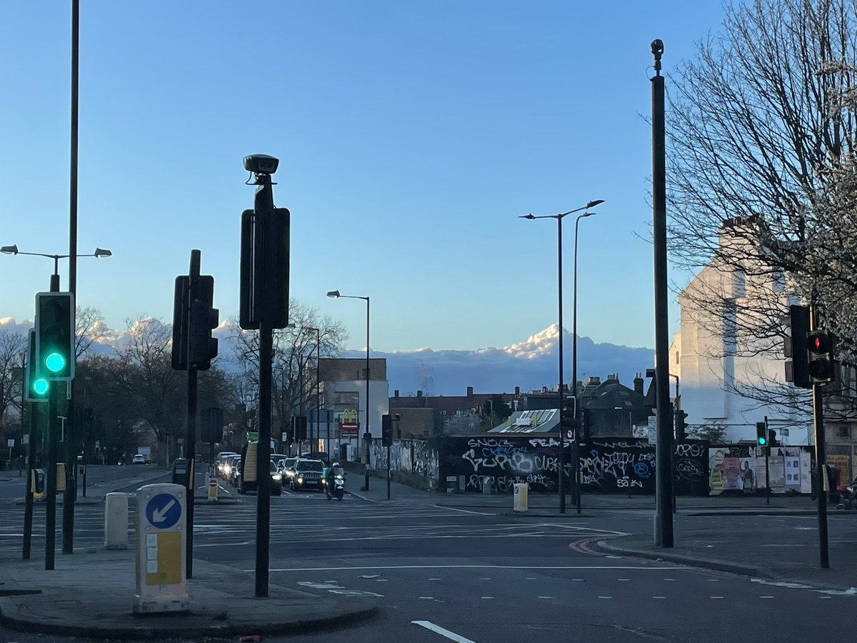 The clouds were so low, London temporarily had views of a snow-capped mountain range.