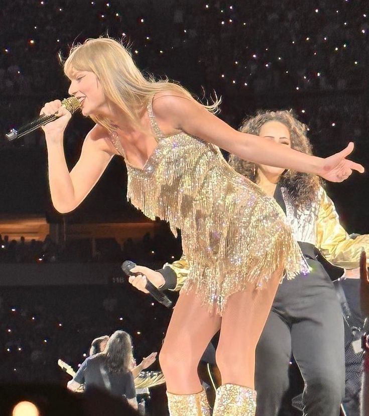 she is wearing the short gold fearless dress! she is wearing the short gold fearless dress!