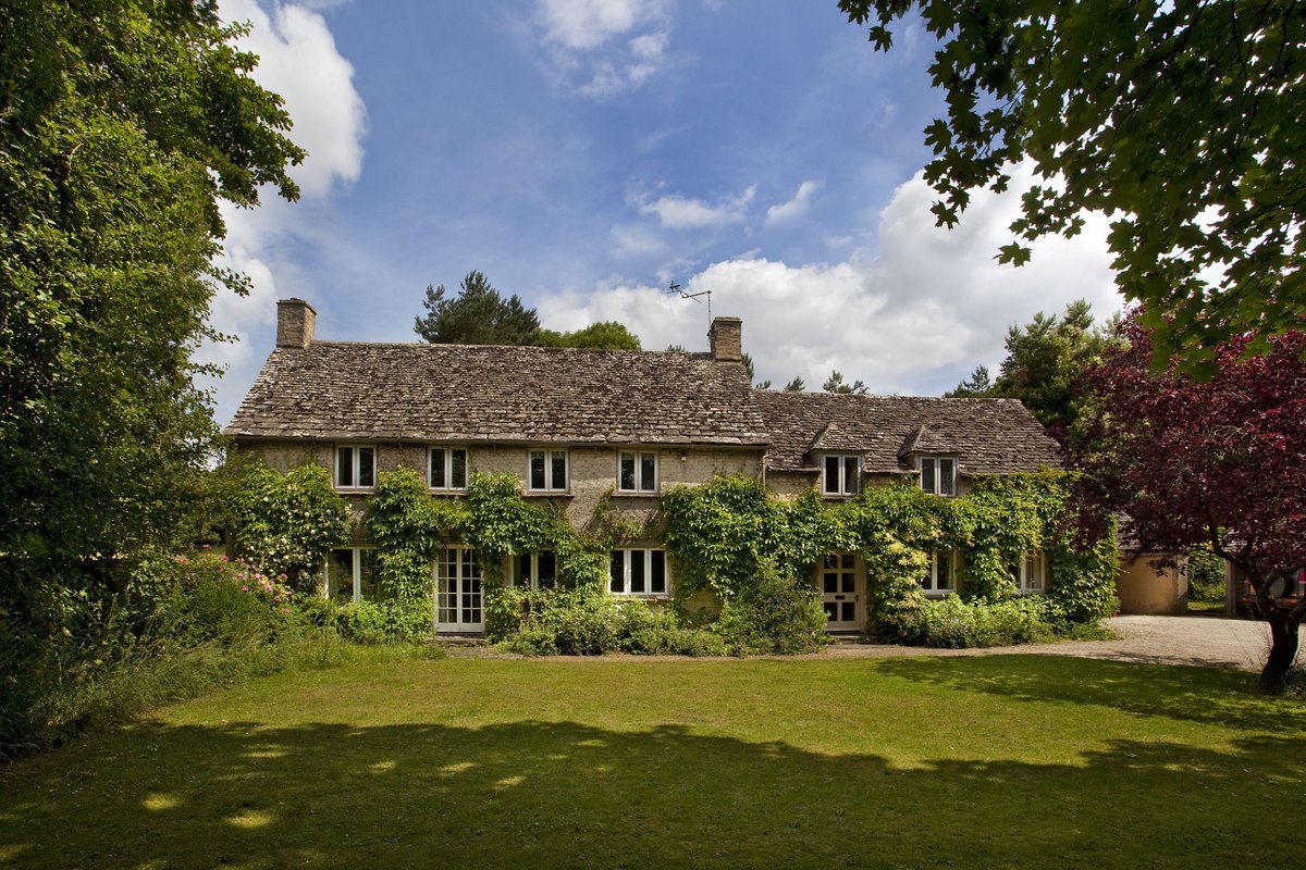 Love the foliage over the windows and doors. Cirencester cottage. The Cotswold, England. NMP.