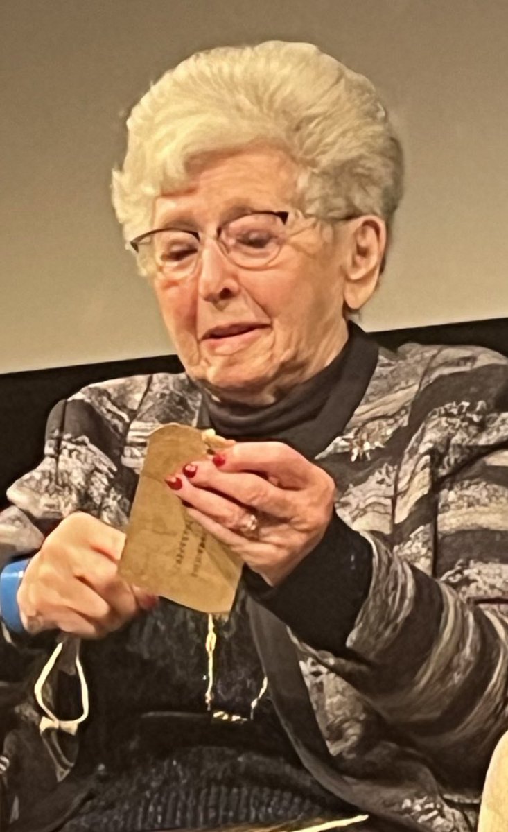 #JewishBookWeek Lady Milena Grenfell-Baines, who escaped Prague on the last train of the #Kindertransport still has her identification label. An opportunity to think carefully about what every child needs to survive war- their families, of course. #EveryWarEveryChild
