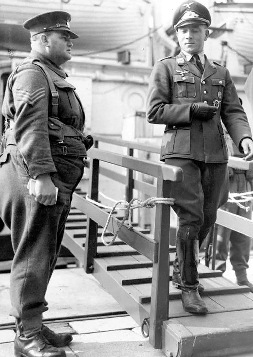 A German officer bodyshames a British noncom POW. WW2