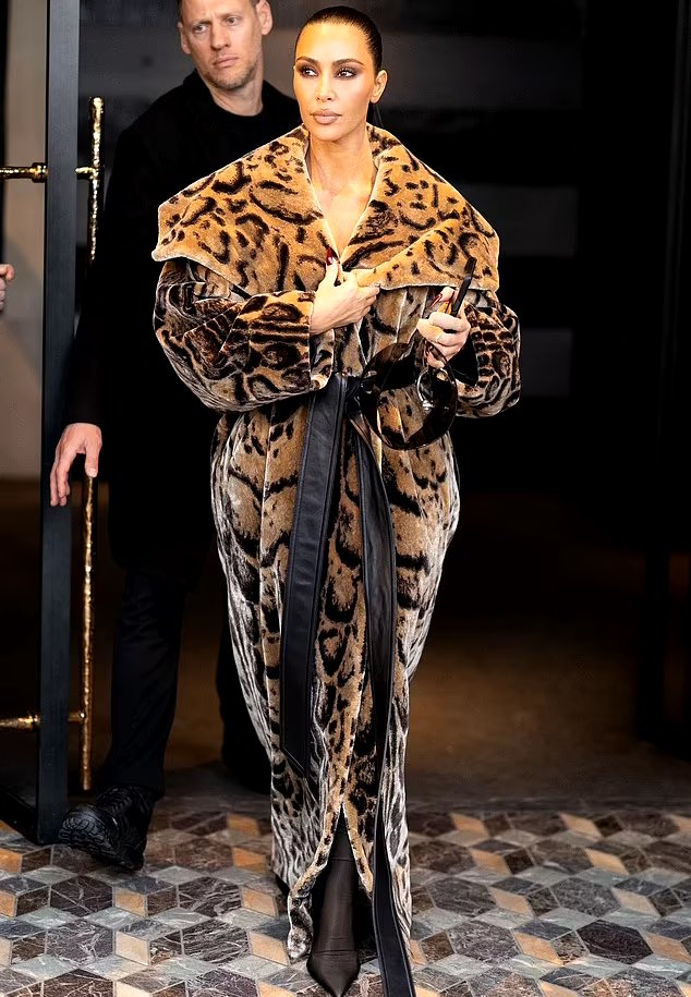 Kim leaving her hotel in Paris. (March 3)