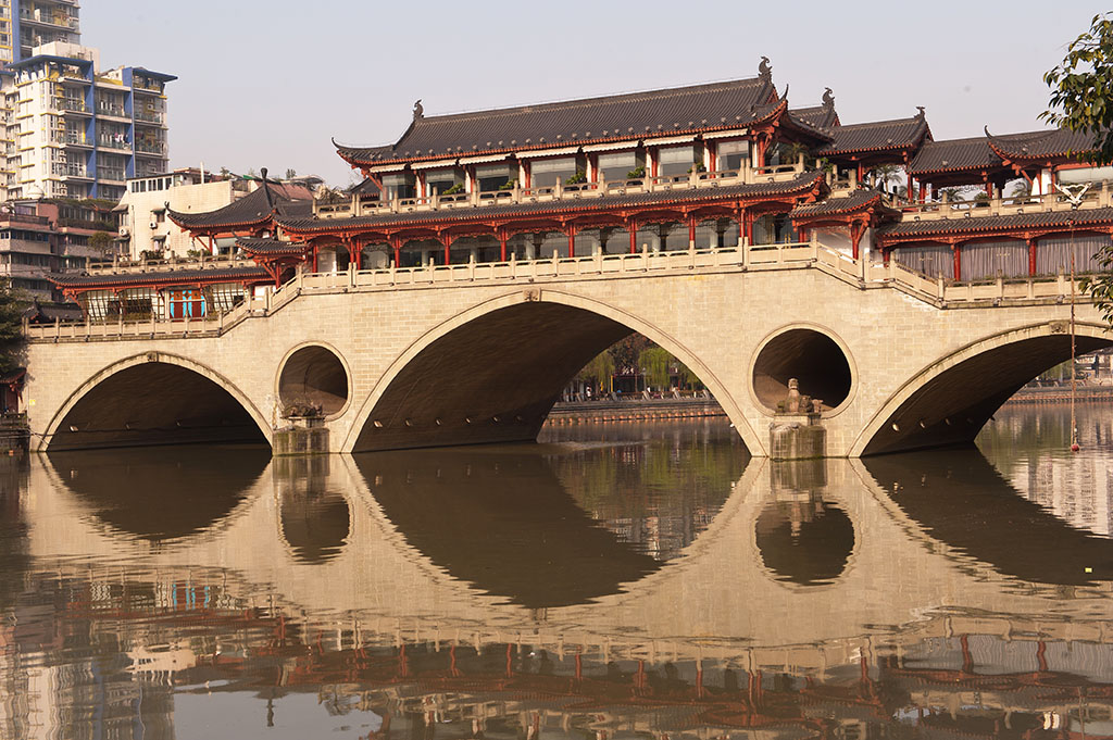 In China, Chengdu's Anshun bridge has been reconstructed many times over the centuries, but still exists in a similar form to the 13th century original - a bridge that Marco Polo wrote about.