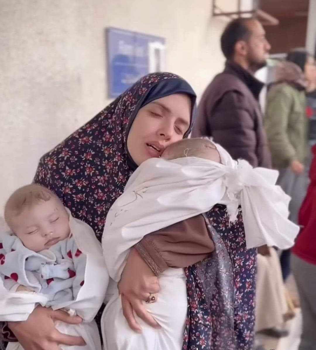 Mother Rania Abu Anza, farewells her twins killed in an Israeli airstrike on her house Sunday in Rafah, souhth of Gaza. (WAFA), photo Hani Alshaer.