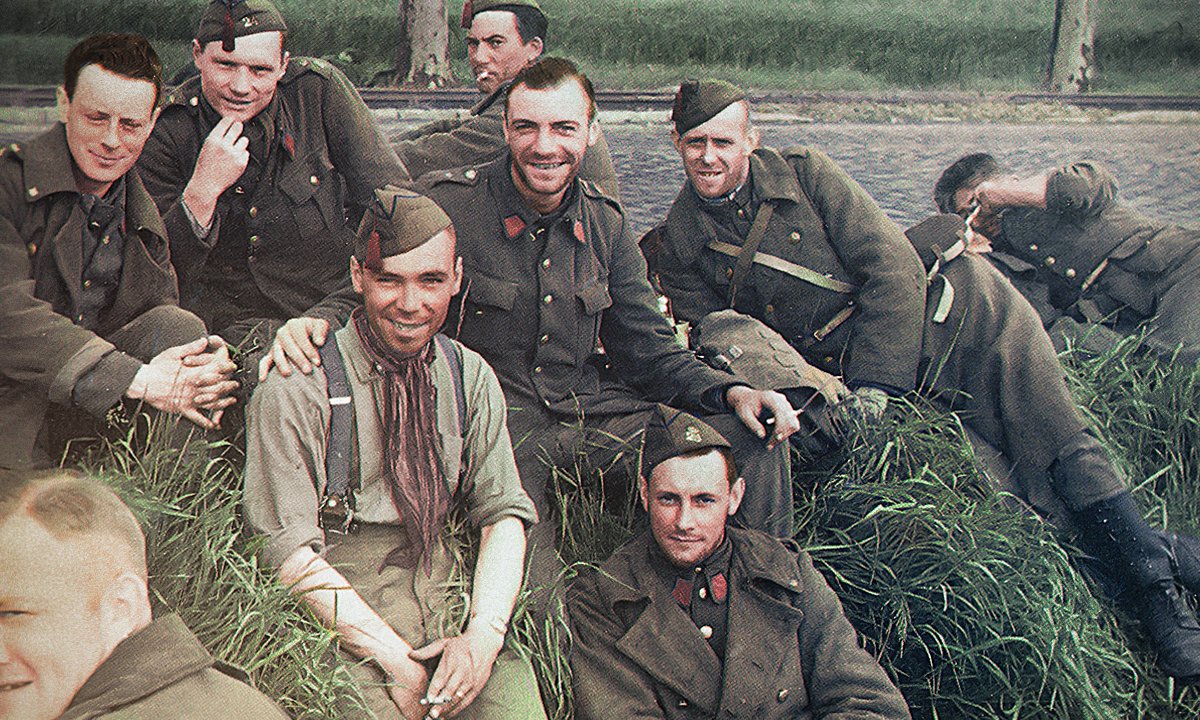 Belgian POWs of the 24th Line Infantry Regiment smile for the PK photographer. May 11th 1940.

Colorisation by me.