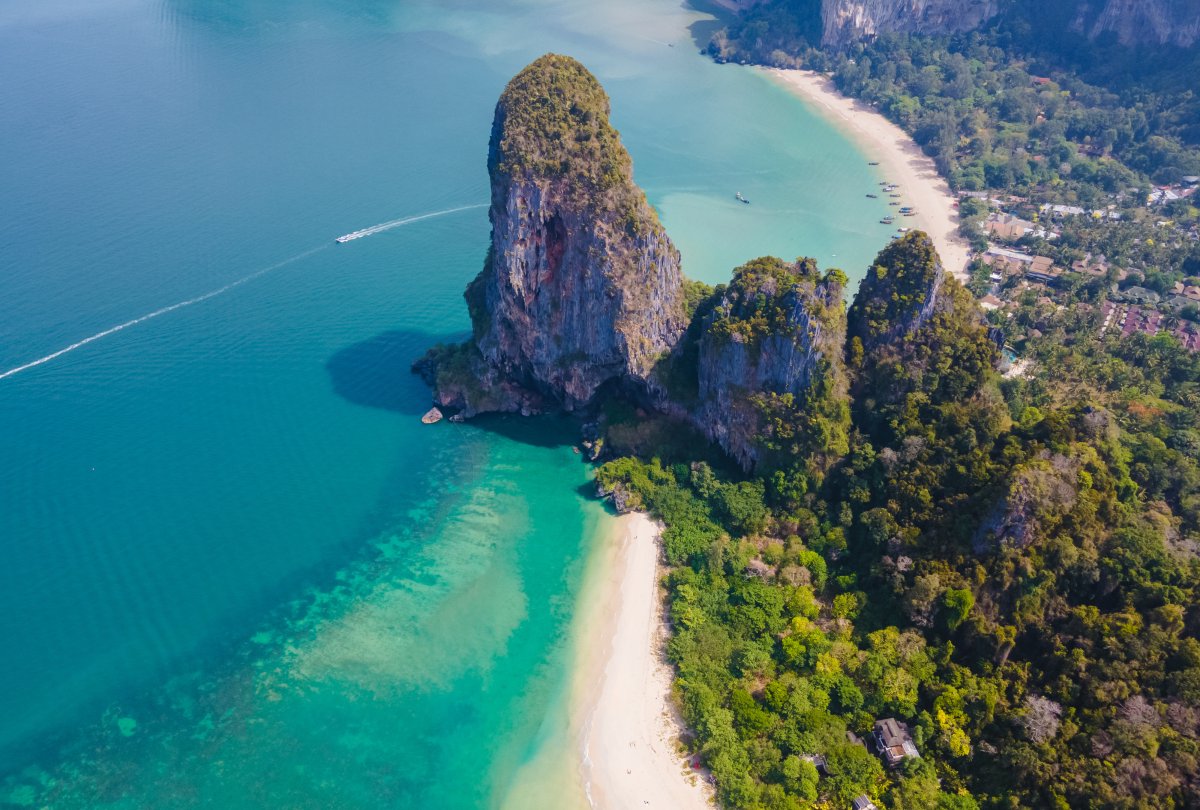 Experience the stunning beauty of Thailand by visiting the serene Railay Beach. Embrace the tropical atmosphere, explore the captivating caves, or simply relax in the glorious sunshine. #TravelThailand #BeachLife #RailayBeach