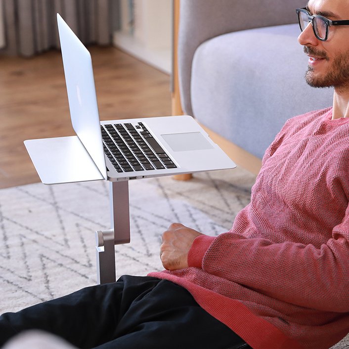 'Don't just stand, stand out with #Maxtand's laptop floor stand. Perfect  for those who love to stretch out and work from anywhere. 🧘‍♂️✨  #FlexibleWorking #FloorDesk #WorkYourWay'