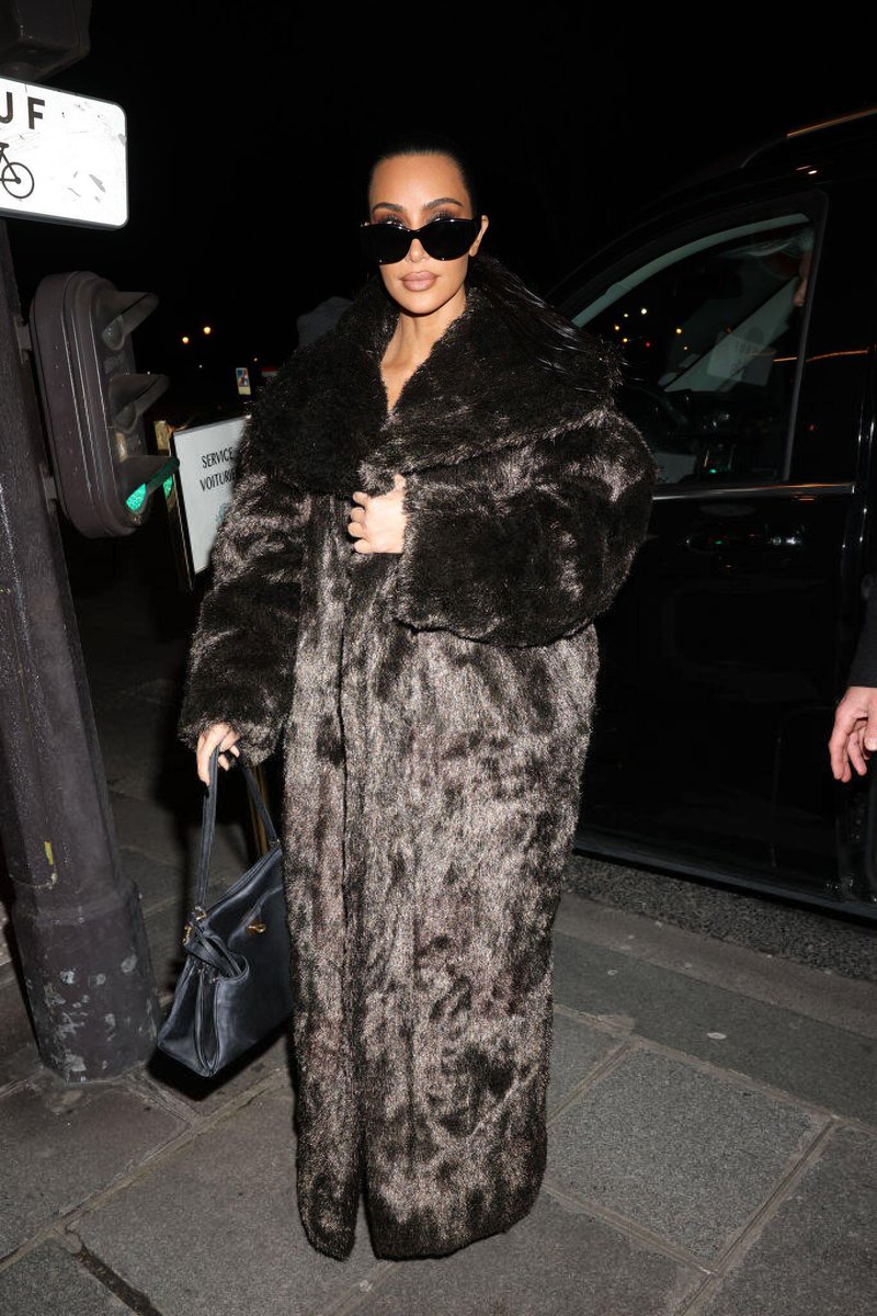 Kim arriving at a restaurant in Paris. (March 3)