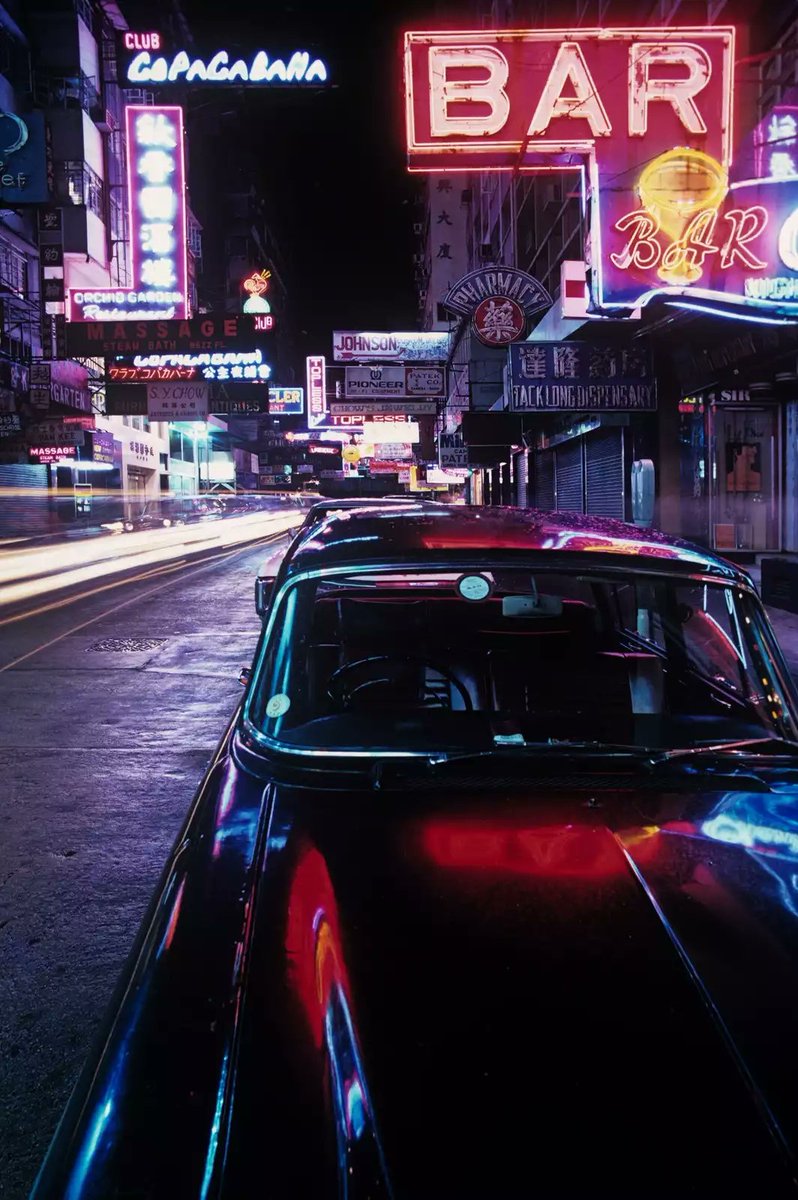 Neon and Black Jaguar, 
Tsimshatsui, 1975 • Greg Girard •