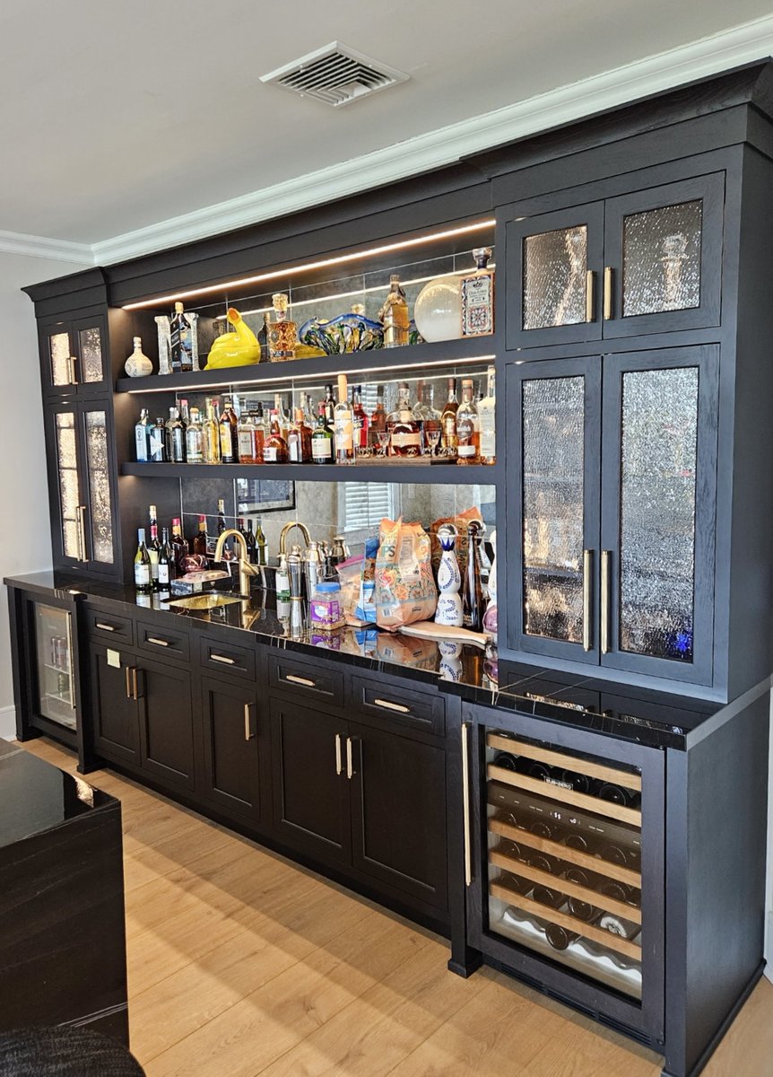 “We adore this living room bar, featuring a glass backsplash that beautifully reflects the waterfront light.”
#thegalleyproducts 
#subzerowolfcove; 
#packardcabinetry; 
#Experience_The_Extraordinary
#kitchendesign
#highendkitchen
#customkitchen
#luxurykitchen
#moderndesign