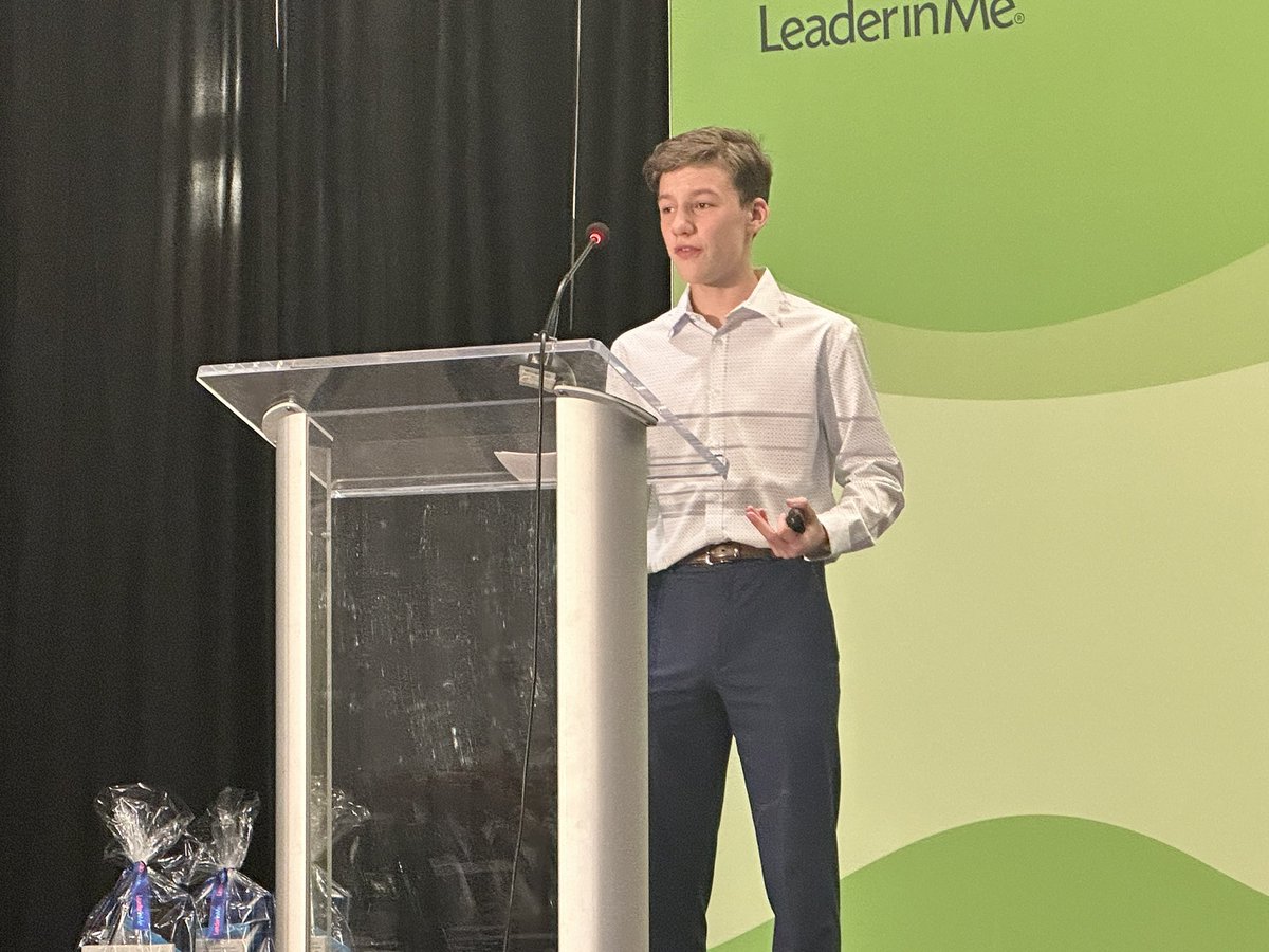 Jacob Lile, Briarwood Elementary student, introduces Muriel Summers to the stage.  #LIMSymposium