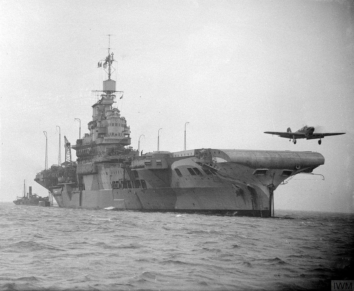 A Fairey Fulmar fighter taking off from HMS Victorious as the ship lay at anchor in Scapa Flow, March 1942.