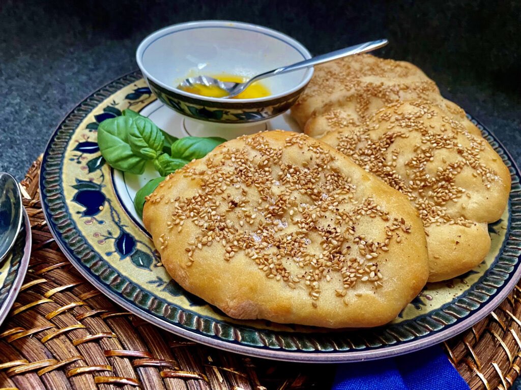 Pide Ridged Flatbreads are from Turkey. The Turkish name tirnakh ekmek (ridged flatbread) refers to the way the ridges of the bread are made by pressing with your fingertips. Hope you’ll visit the blog and this space for all the new global favorites. Have you had them?