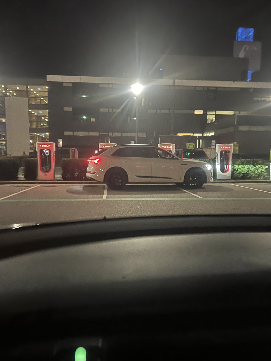 DeMildeDictator's tweet photo. Opening the Tesla charge network to all vehicles is great, but the way the non-Tesla’s charge isn’t so great. Do the next gen chargers have longer cables to avoid situations like this? @Tesla @elonmusk https://t.co/Tkz9naS5J3