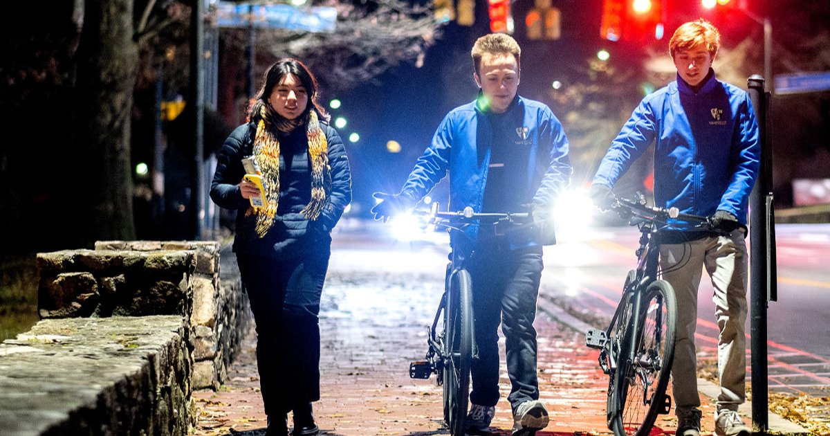 UNCCoalition's tweet photo. In this article, learn more about SafeWalkers: the UNC students ensuring safe walks home for their peers on campus during late hours. This student-run initiative enhances the sense of security at UNC-Chapel Hill. #UNCStudents #UNCCH https://t.co/RiWcYRZaBE https://t.co/BoHJ0IXTvj