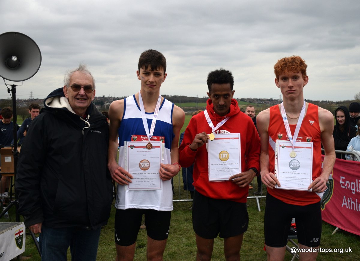 English Schools XC Senior Boys Championship race - L-R 3rd Quinn Miell-Ingram Oxfordshire 19.26, 1st Aron Gebremariam West Midlands 19.15 & 2nd James Dardan Hampshire 19.19 with sponsor David Minter @SchoolAthletics @AthleticsWeekly