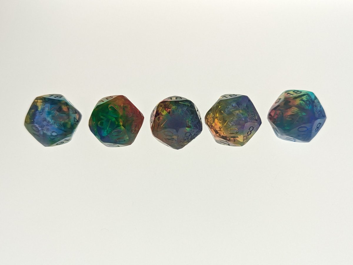 Gem cut rainbow D20s!

Raw, unfinished dice.

#HandmadeDice #DiceMaking #TTRPGDice #CustomDice