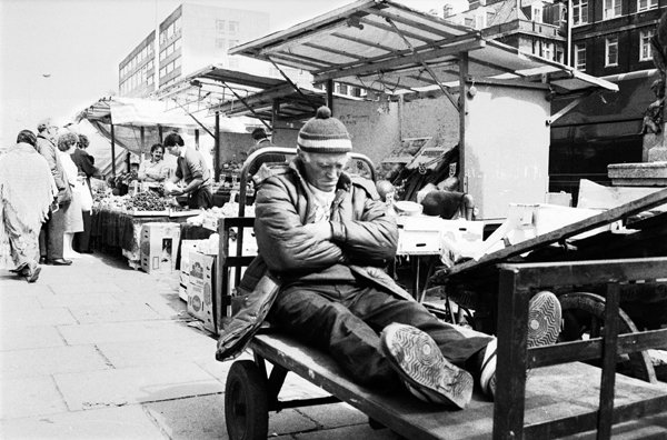 #sleeping in #Whitechapel #Market #1980s #blackandwhitephotography by Philmaxwell.org #35mmfilm #Documentary