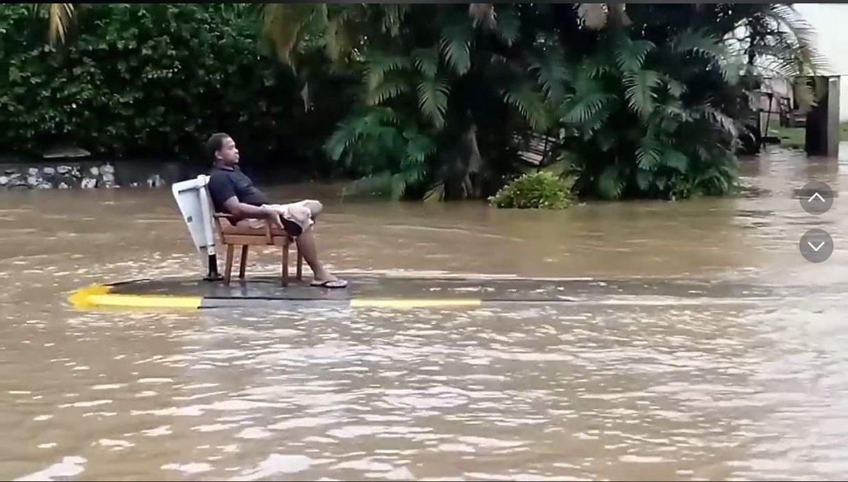 achandftv's tweet photo. This was today at the Namotomoto village in Nadi - someone got a chair and sat comfortably on one of the traffic islands with flood waters around him #Fiji #FijiNews https://t.co/Dz9EAf3SUn