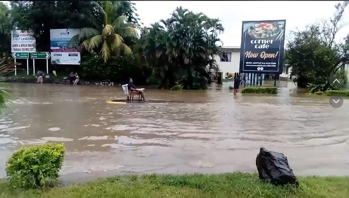 achandftv's tweet photo. This was today at the Namotomoto village in Nadi - someone got a chair and sat comfortably on one of the traffic islands with flood waters around him #Fiji #FijiNews https://t.co/Dz9EAf3SUn