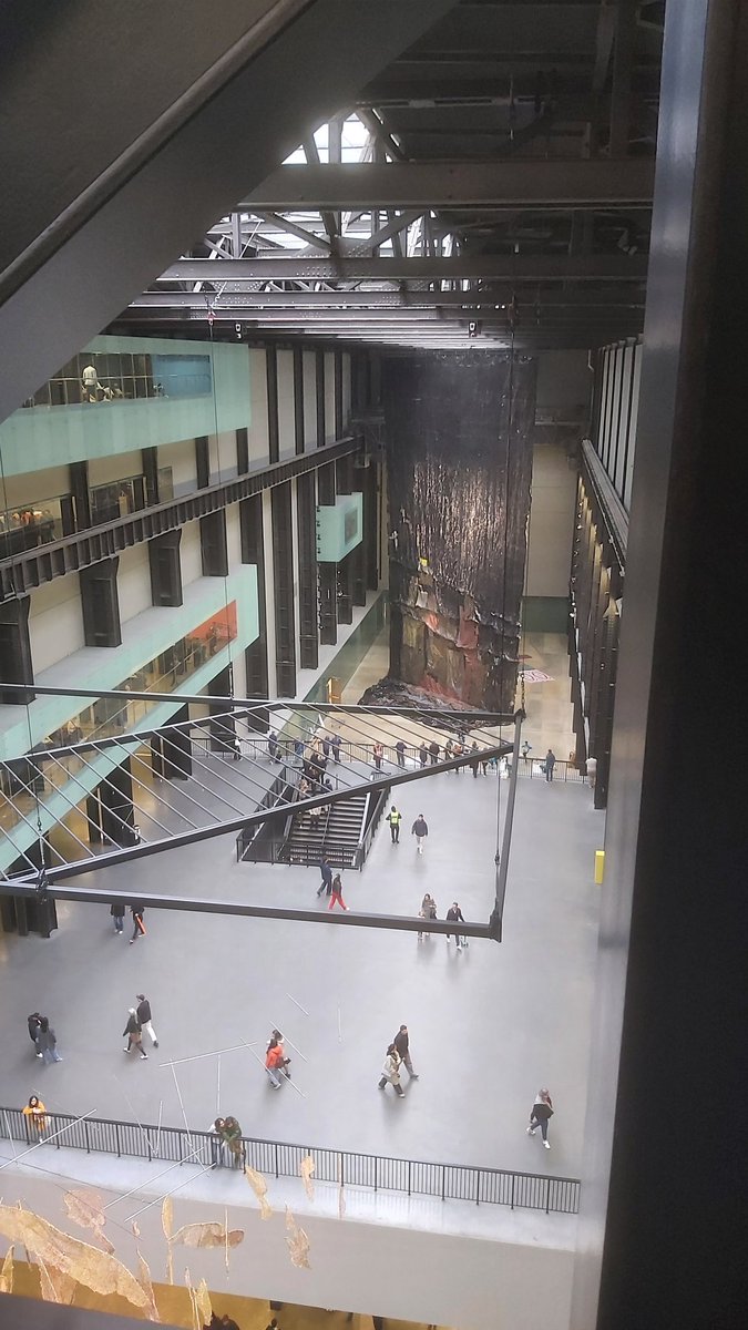 PhilipGlanville's tweet photo. Not been to @Tate Modern for a decade nor seen the new extension from inside, so yesterday was a jot. From the underground tanks to new gallery spaces it was wonderful to fall in love with the Tate again. Amazing seeing El Anatsui's #BehindtheRedMoon from below, across & above. https://t.co/9qQQ3EcjUt