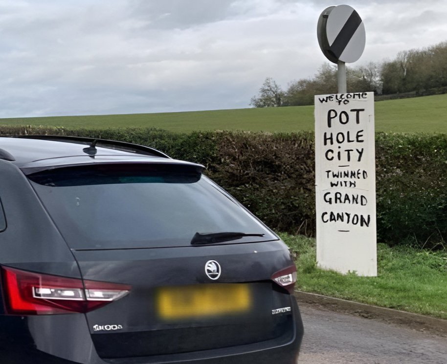 Daventry's #potholes are so bad, the town has been twinned with the #grandcanyon - these hand made signs have popped up overnight - who made them?

#northamptonshire #potholehell