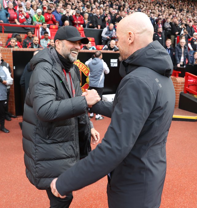 An image of Erik ten Hag and Jurgen Klopp shaking hands ahead of kick off