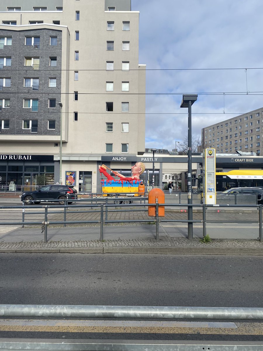 BethGorham's tweet photo. In Berlin. Putin’s bloodbath getting towed by a car. https://t.co/GxmA9KONB3