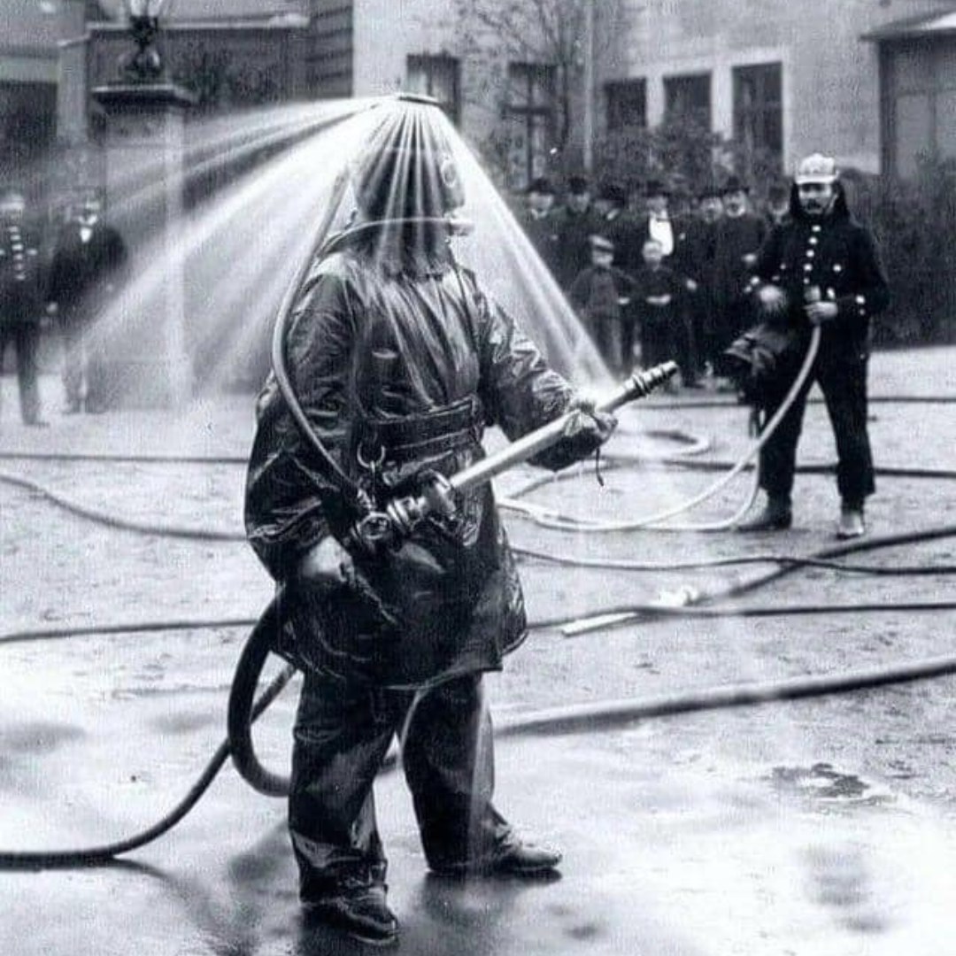A public demonstration of König's fire helmet, Germany, 1900s.⁠
