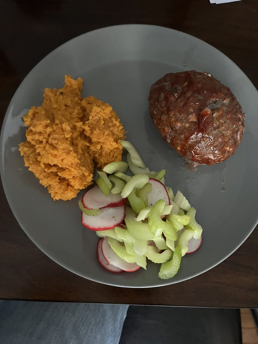 Sunday dinner. Personal meatloaf, mashed sweet potatoes with butter and cinnamon, and a small celery and radish salad because they were the only vegetables I had besides a zucchini which I’m saving for tomorrow nights dinner.