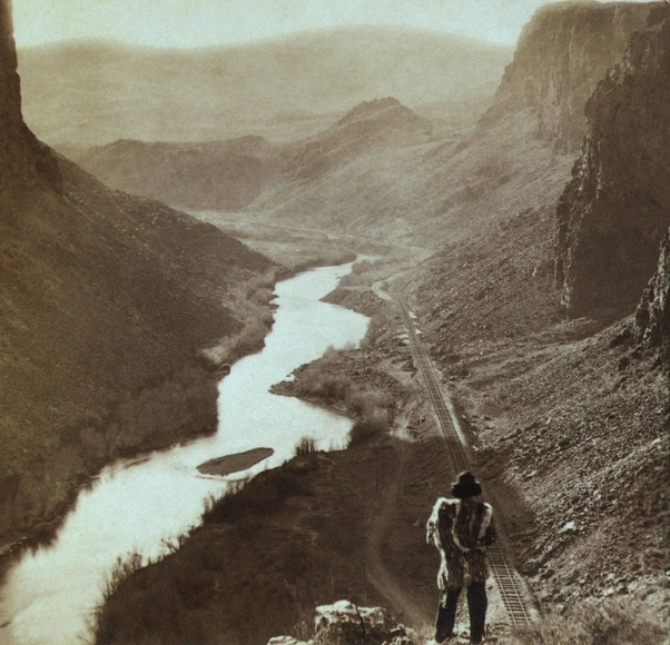 This photograph shows a Native American man looking over the newly completed transcontinental railroad in Nevada in the year 1869. Let's assume the man was around forty and was born in the 1820s. The changes he must have seen are astonishing.

What this man is looking at, is the