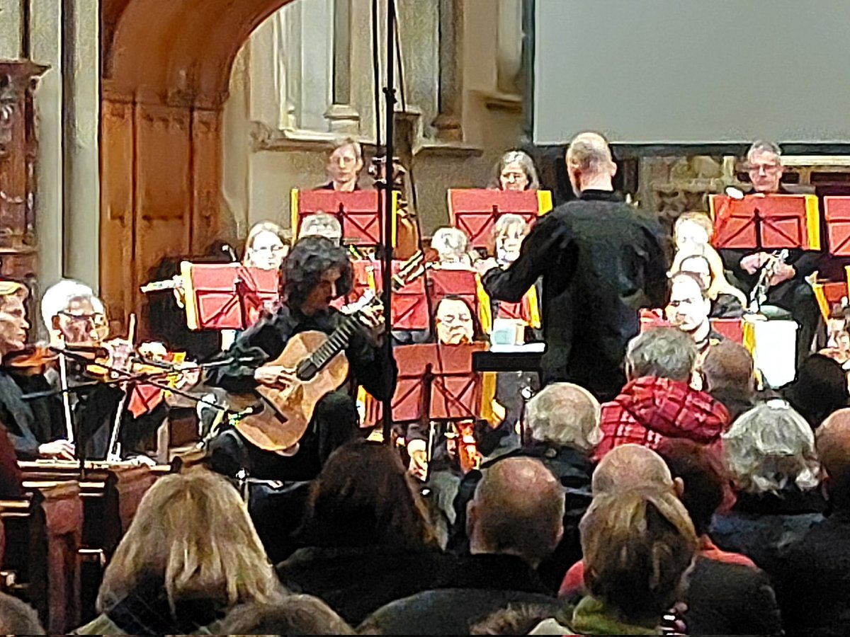 DorkingPhil's tweet photo. What a great evening yesterday - a fantastic performance by guitarist Pavel Ralev, an exciting world première and the fantastic 3rd Symphony by Beethoven. Huge thanks to Paul Newbold and Pavel, and to Derrick Coonghe and David Blow for the photos. Next concert 22nd June! https://t.co/a4XjOAg5Wz