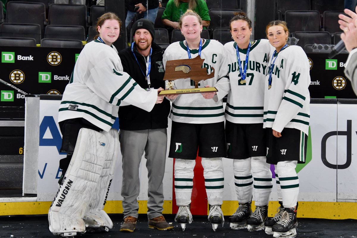 Captains Anna McGinty, Maddie Greenwood, Cammy Holloway and Reese Porter hoist the trophy with coach Dan Najarian. More photos from Marilyn Quilty in the sports section.