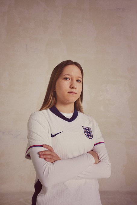 Lucja Wyrwantowicz poses for a photo in the new England home shirt.