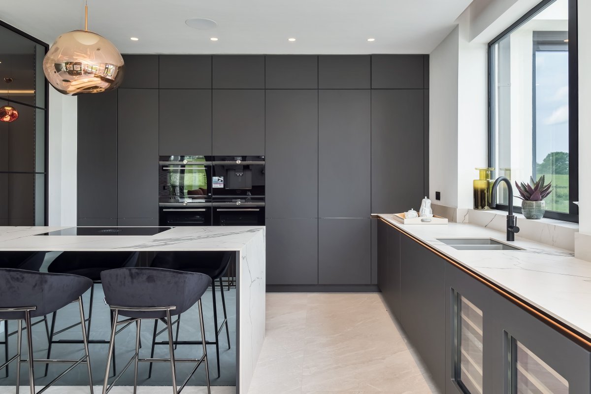A grey kitchen is both modern and classic, offering a versatile canvas for your design ideas. Light greys can make small spaces feel open, while darker tones add depth to larger areas. And the best part? It's a timeless choice that won't go out of style anytime soon.