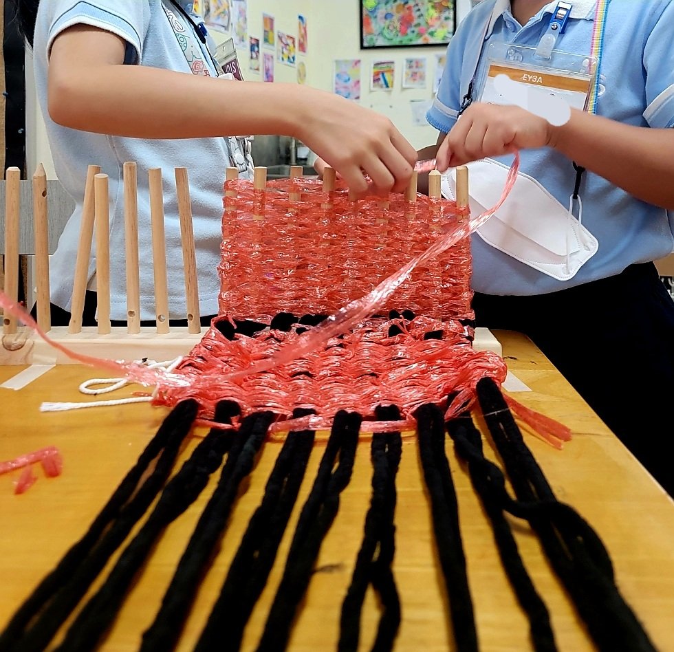 Grade 10s made us a peg loom! And it is a HIT! Interesting how much they talk while weaving... therapeutic?