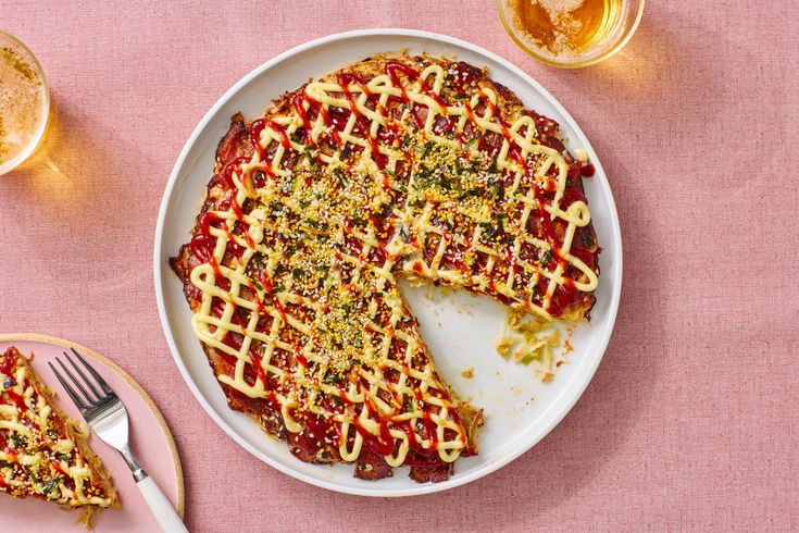 Comprised of a custardy pantry-forward okonomiyaki batter studded with shredded cabbage and bacon, this Japanese pancake is a fast track to dinner. dlvr.it/T4DrR4