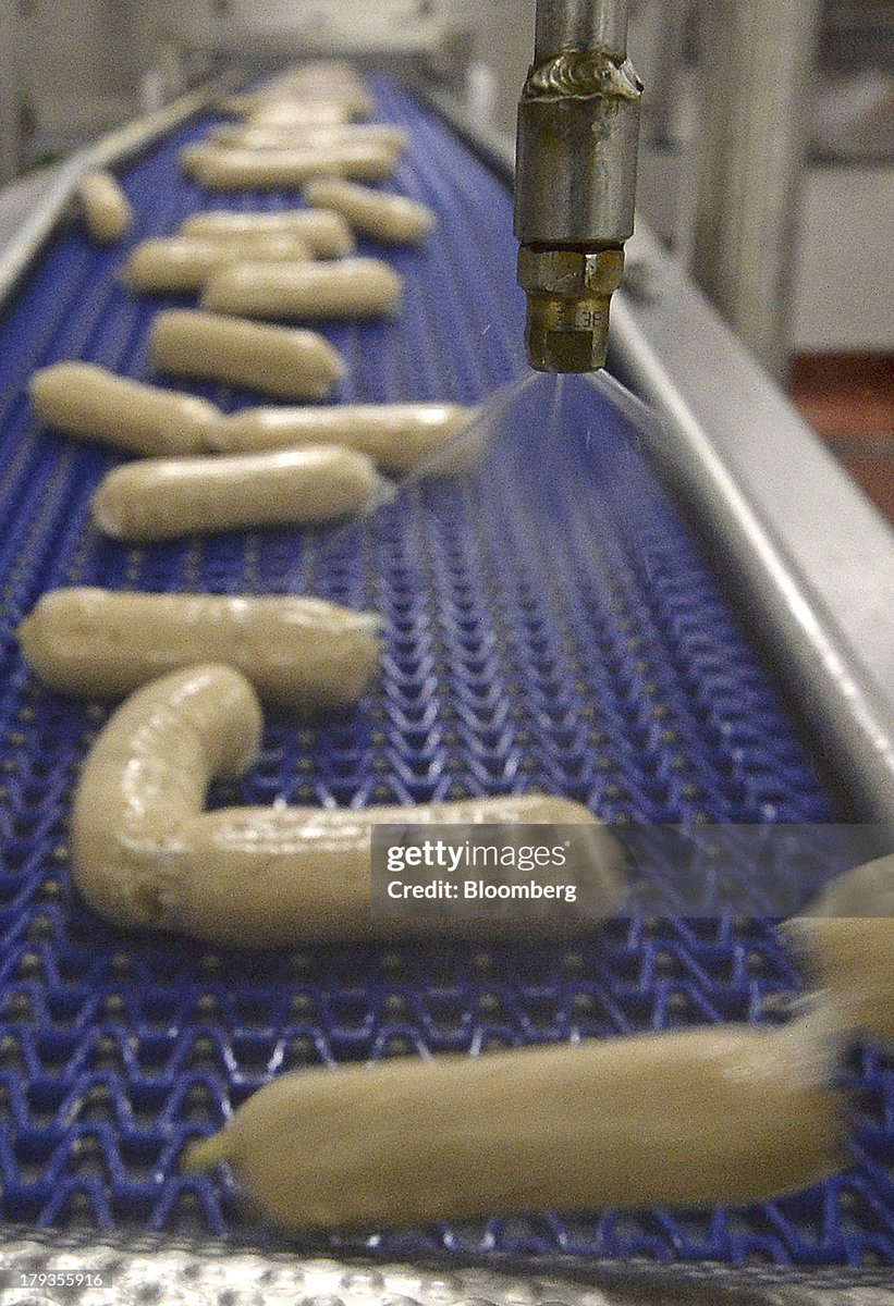 Meat-free Quorn sausages, manufactured by Quorn Foods, a unit of Exponent Private Equity LLP, travel along the production line ahead of packaging at the company's factory in Stokesley, U.K., (2013)