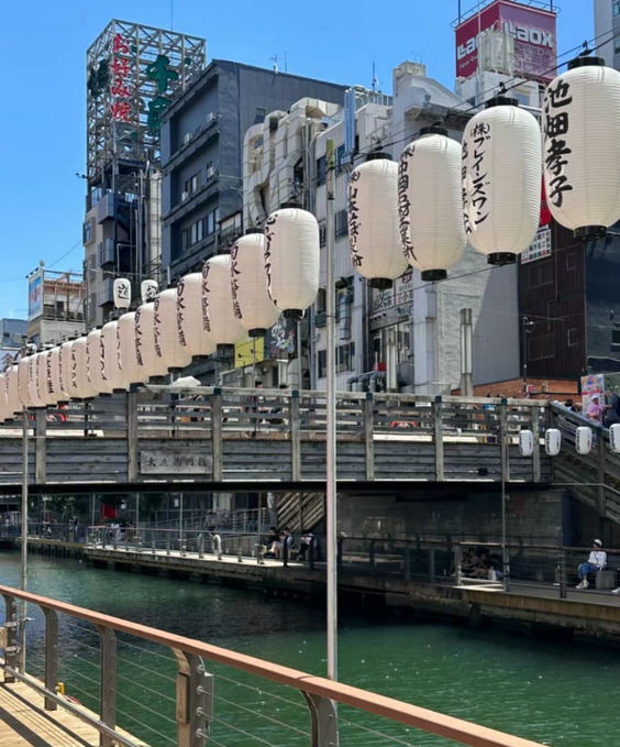 A lively urban scene in Japan, likely in one of its bustling city centers
