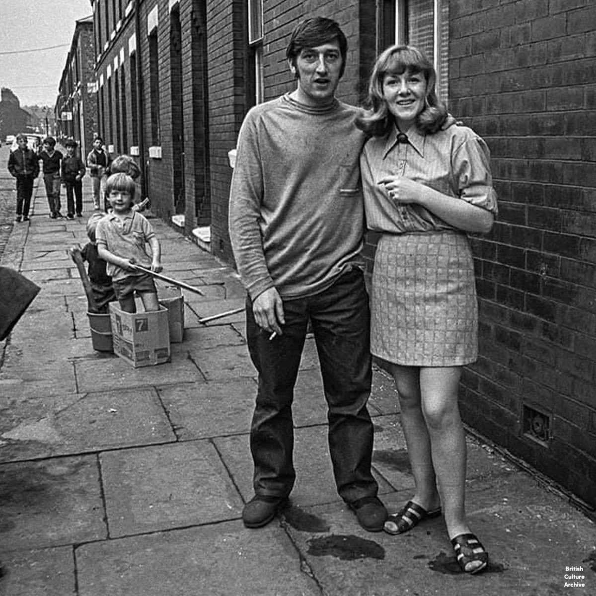 britcultarchive's tweet image. Langton Street, Salford, 1970 and 2024.

Jack Youd: "I grew up fascinated by this photo from 1970 of my Grandad (29) and Grandma (23) taken outside their home at 26 Langton St Salford 6. My Dad and Uncle are “rowing up the Amazon”, my grandad's motorbike and sidecar is covered…