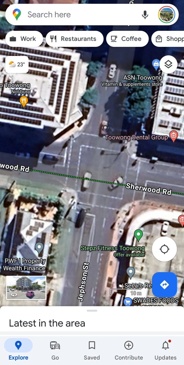 Ludicrously large intersection of 2x 4 lane streets in a shopping and high density residential precinct with no cycling infrastructure. Another victim of Brisbane City Council traffic engineers.