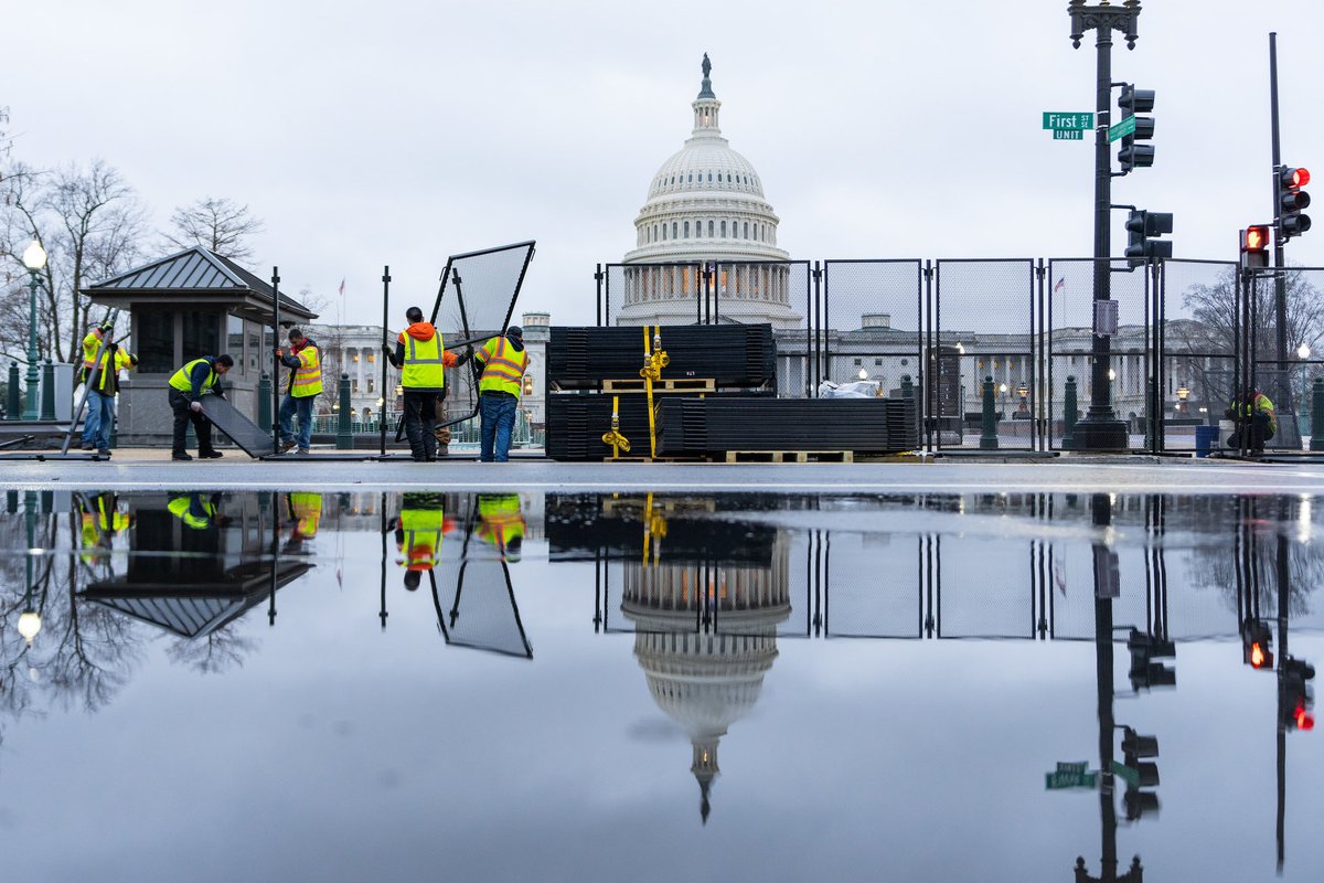 Workers install the security fence for the #stateoftheunion outside the Capitol