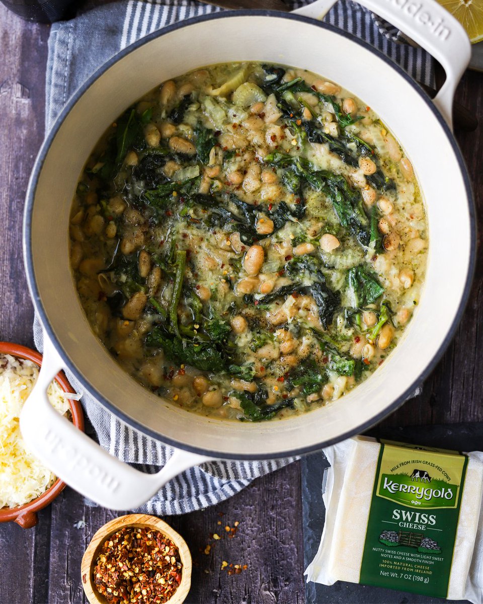 Enjoy the last few chilly weeks of the season with the comforting flavors of white beans nestled within broccoli rabe, lemon, and Swiss cheese. Get the recipe: kerrygoldusa.com/recipes/braise…