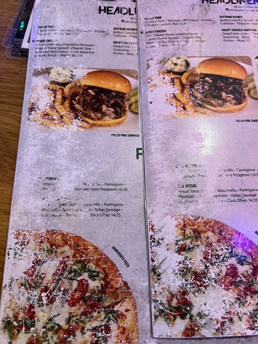 Menus are looking pretty sad at <a href="/RockAndBrews/">Rock & Brews</a> Orlando. I hope the items that can’t be read aren’t something I would want. Also they are short on menus so we have to share around the table and give them back before we order.